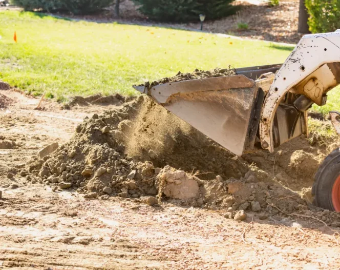 Small Bulldozer Digging In Yard For Pool Installation